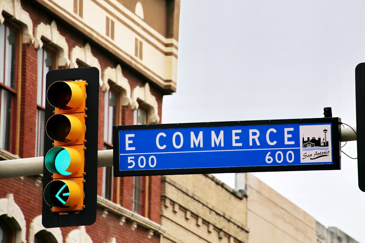 A storefront and a laptop side by side — dropshipping versus ecommerce