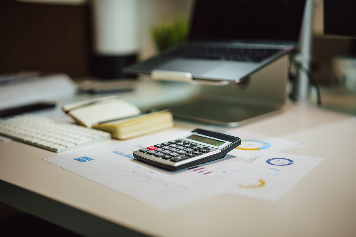 A calculator next to a laptop — running the numbers on dropshipping